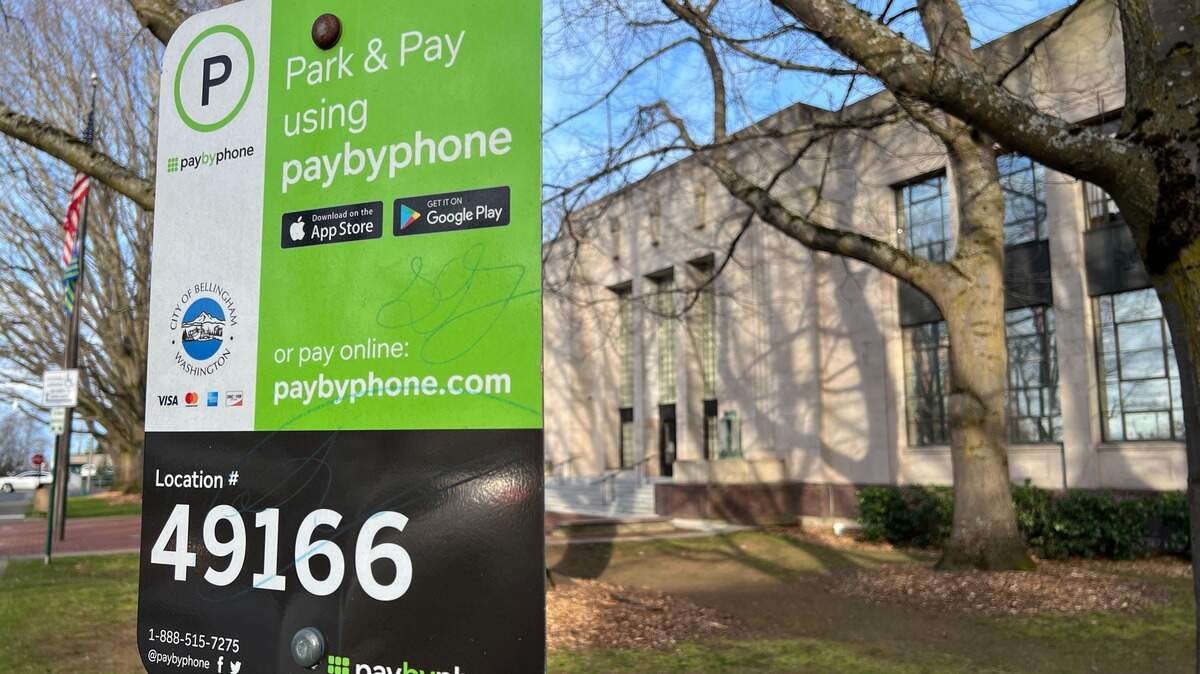 A sign outside City Hall at 210 Lottie St. in Bellingham tells drivers to use the PayByPhone mobile app or use its website for parking. A sign outside City Hall at 210 Lottie St. in Bellingham tells drivers to use the PayByPhone mobile app or use its website for parking.